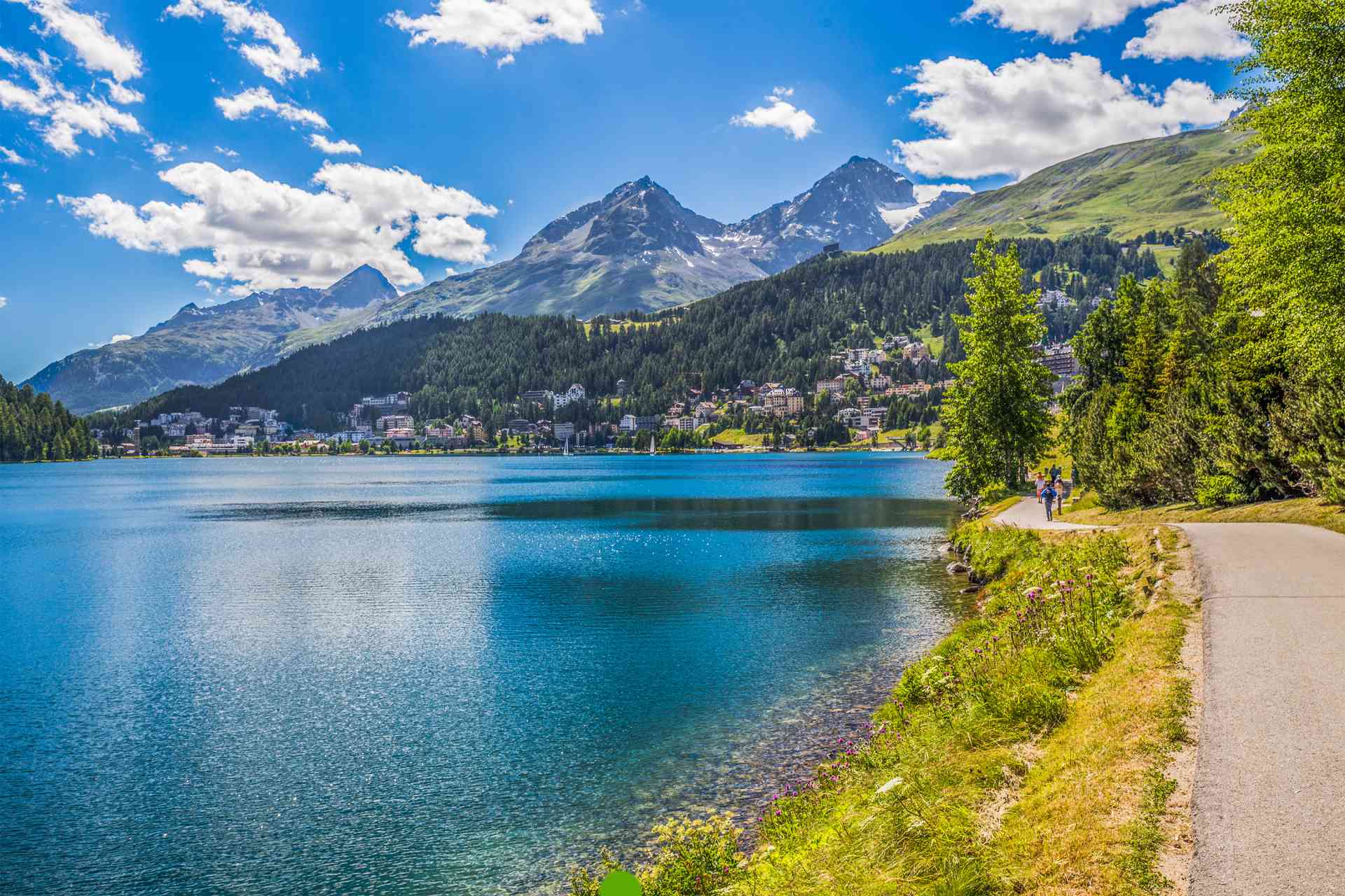 Pristine blue lakes nestled among towering Swiss and Italian Alps.